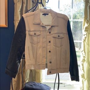 Denim jacket with black leather sleeves